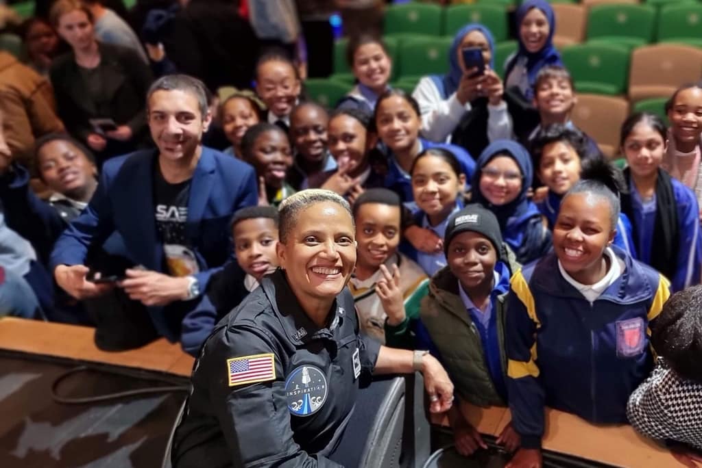 A NASA astronaut meets students during a Meridian youth program